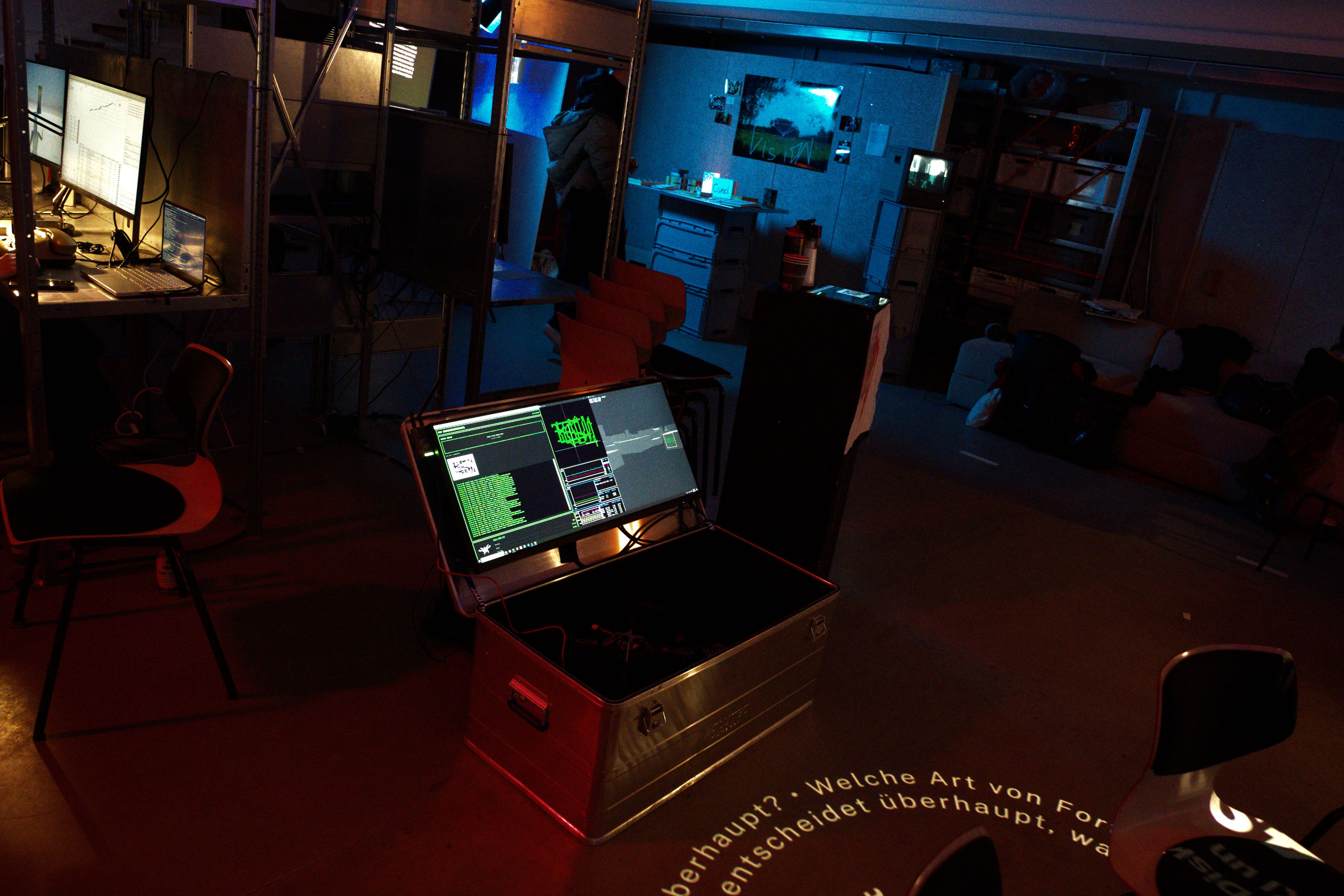 Picture of the U.A.V. installation, showing a graphic from a visitor, and the simulation of its spray by the drone